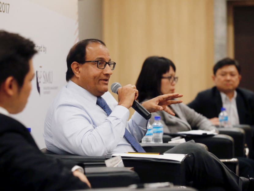 From left: Minister of Trade and Industry S Iswaran, Audrey Kuah Managing Director, Global Data Innovation Centre, Dr Lim Kuo-Yi Managing Director and Partner, Monk's Hill Ventures, were the panellists for the Economic Dialogue session held at Innovis Building on 28th August 2017. Photo: Najeer Yusof/TODAY