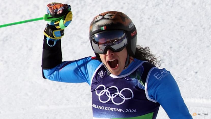 Alpine skiing-Brignone completes golden double on home snow