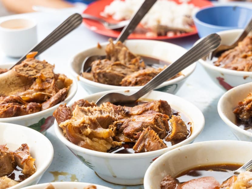 Bowls of bak kut teh, a pork bone soup made with aromatic herbs and spices.