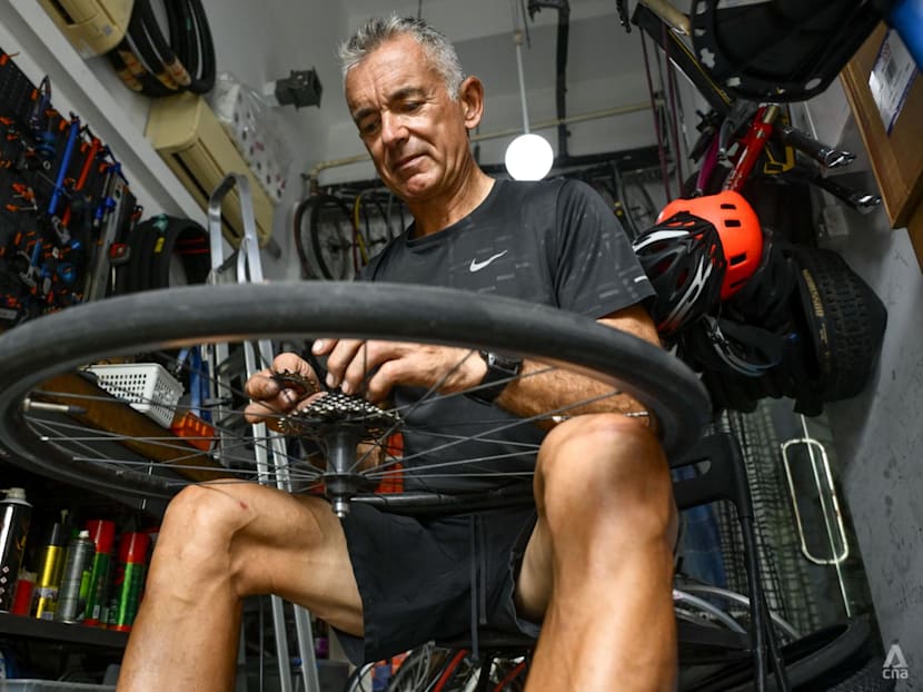 Once a banking high-flyer, this expat repairs bikes for free for migrant workers and others in need