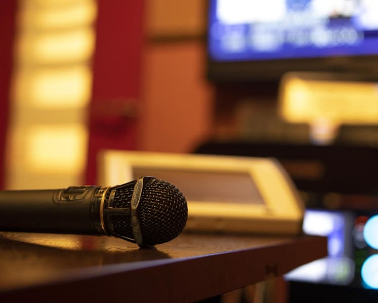 Karaoke lounge owner fined for unlicensed use of Chinese pop songs after prosecution by music licensing body