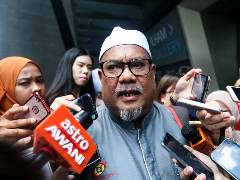 Mohd Shahrir Abdul Aziz speaks to reporters at the entrance of the Ilham Tower.
