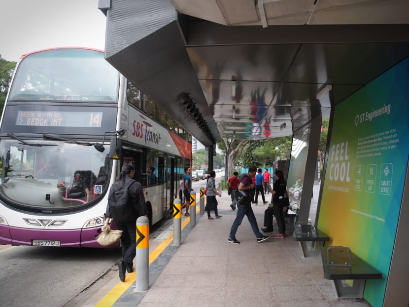 Commuters at a next generation smart bus stop outside Plaza Singapura on March 12, 2018.  Innosparks, an ST Engineering Open Lab, launched the  bus stop, which harnesses digitalisation and data analytics to transform commuters' transit experiences and to address commuters' various challenges. Photo: Jason Quah/TODAY
