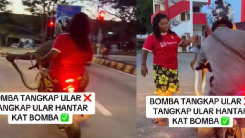 பாம்பைப் பிடித்துக்கொண்டு மோட்டார்சைக்கிளில் சென்ற தம்பதி