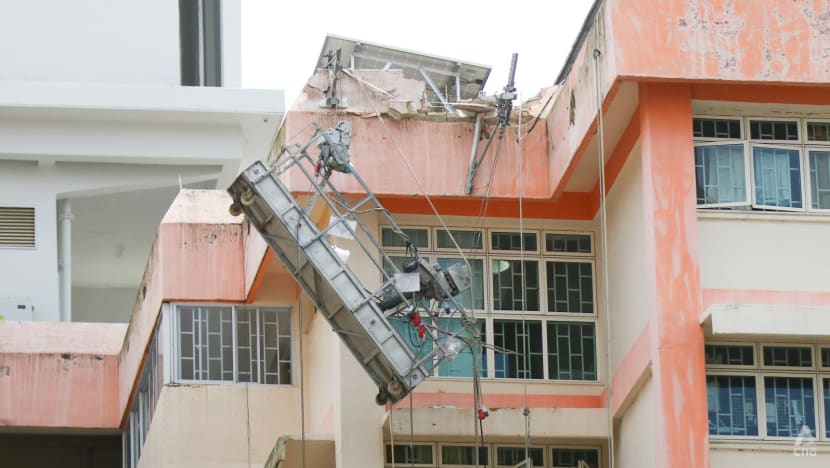 Two workers taken to hospital after gondola tips to one side at Boon Lay Drive HDB block Two workers taken to hospital after gondola tips to one side at Boon Lay Drive HDB block