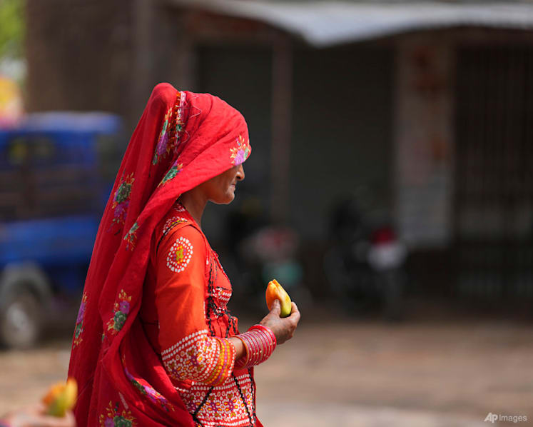 Nearly 100 die as India struggles with a sweltering heatwave in 2 most populous states