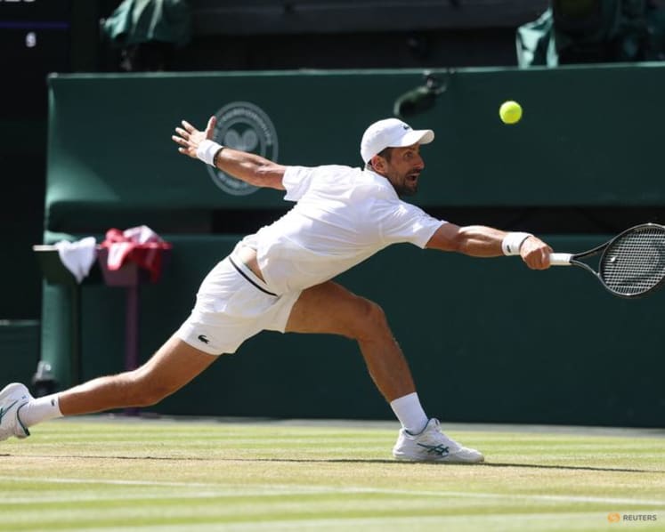 Djokovic moves past another Federer milestone to make Wimbledon quarter-finals