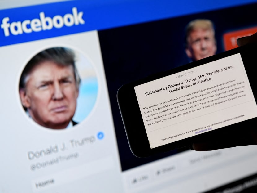 A phone screen displays the statement of former US President Donald Trump on his Facebook page background in Arlington, Virginia, US on May 5, 2021.