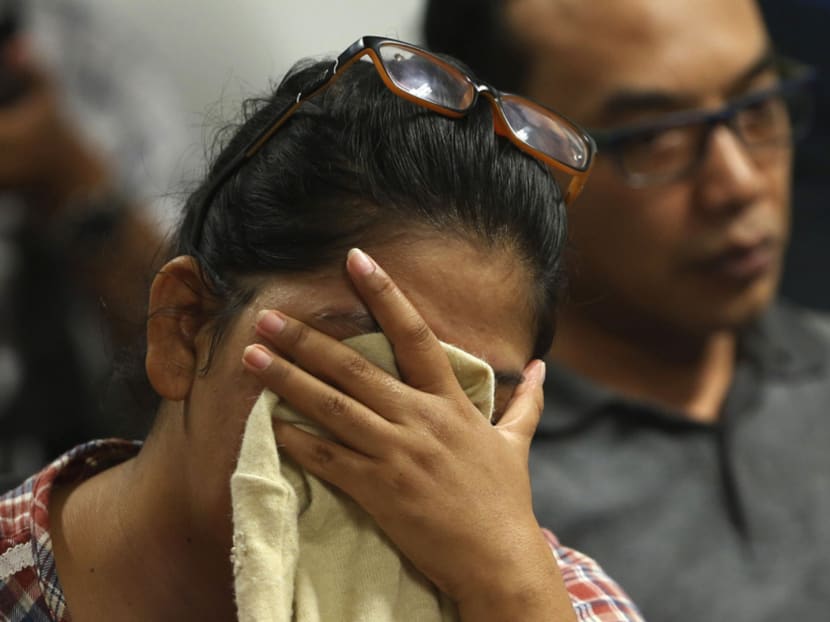 Family members of passengers onboard AirAsia flight QZ8501 at a waiting area in Juanda International Airport, Surabaya December 28, 2014. Photo: Reuters