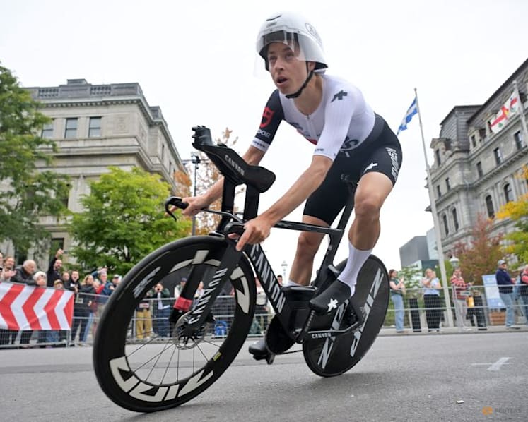 Birthday girl Reusser retains world time trial title in Montreal