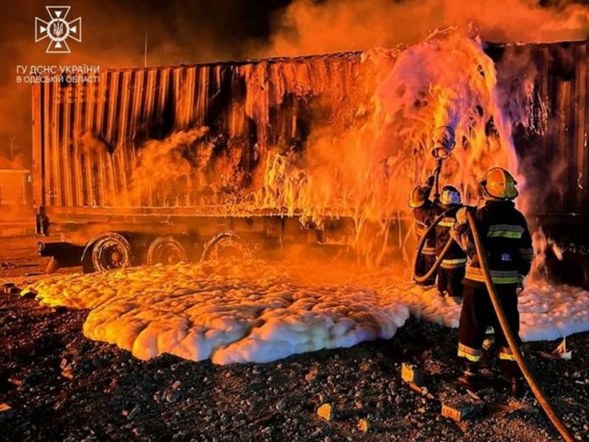 Firefighters work at a compound of a port on Danube river damaged by a Russian drone strike, amid Russia's attack on Ukraine, in Odesa region, Ukraine October 6, 2023. Press service of the State Emergency Service of Ukraine in Odesa region/Handout via REUTERS/File Photo