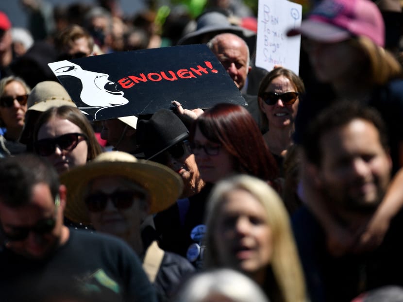 Protesters attend a rally against sexual violence and gender inequality in Australia's capital city Canberra on March 15, 2021.