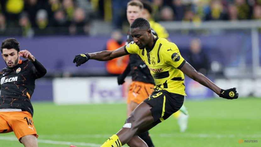 Dortmund beat Shakhtar Donetsk 3-1 to reach Champions League knockout play-offs Dortmund beat Shakhtar Donetsk 3-1 to reach Champions League knockout play-offs