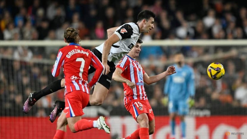 Atletico claim provisional top spot with 3-0 win at Valencia