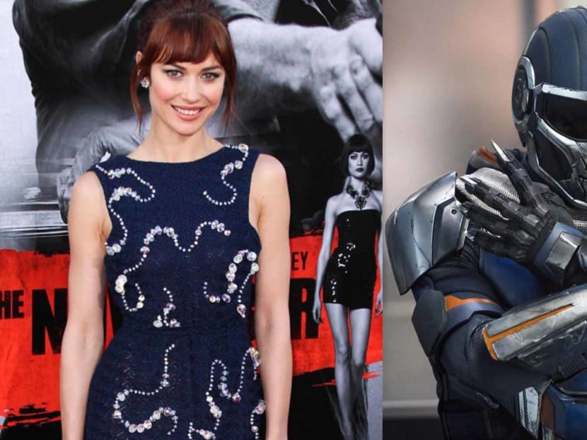Olga Kurylenko needed more than one person to help her put on the Taskmaster suit.