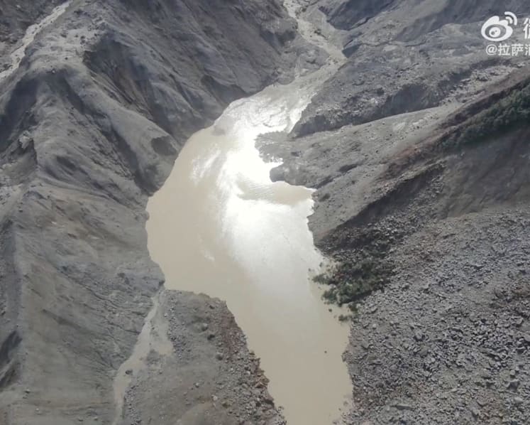 Lake overflows on Nepal-China border, sparking panic and halting rescue