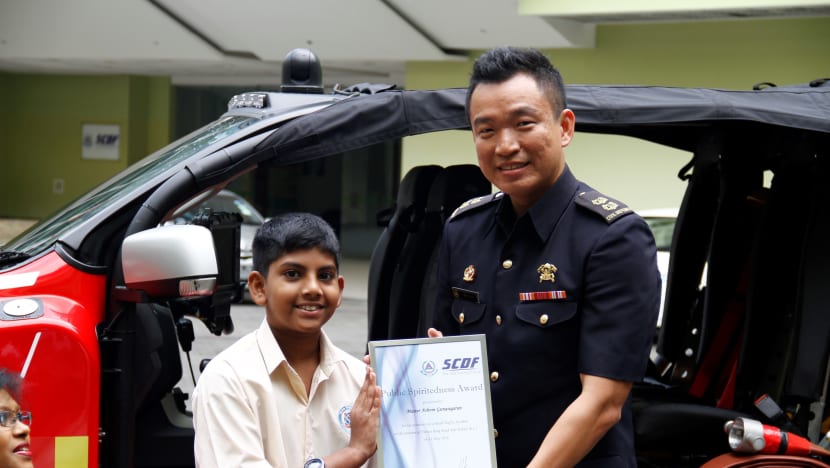 SCDF award for 12-year-old who helped accident victims
