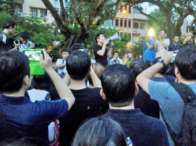 Singaporean activist Jolovan Wham (with loudhailer)

 has been ordered to pay S$6,063 to the AG for a failed 

bid to quash a police warning against him. TODAY FILE PHOTO