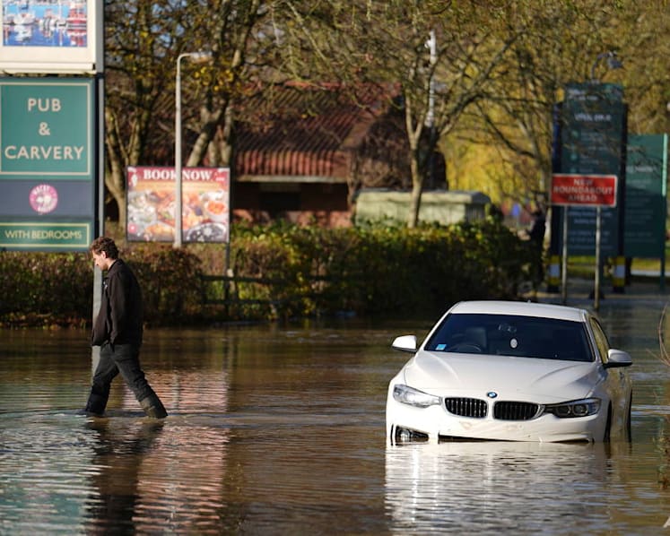 Hundreds of homeowners in England and Wales battle floodwaters after weekend storm