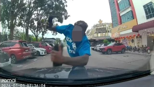 新山男子飞扑马赛地疑为碰瓷 女司机公开视频证清白