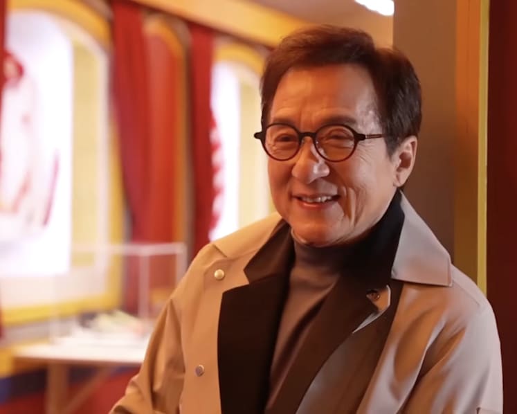 Jackie Chan's first time at Milan Fashion Week has fans amused as he looks like he 'accidentally wandered' in