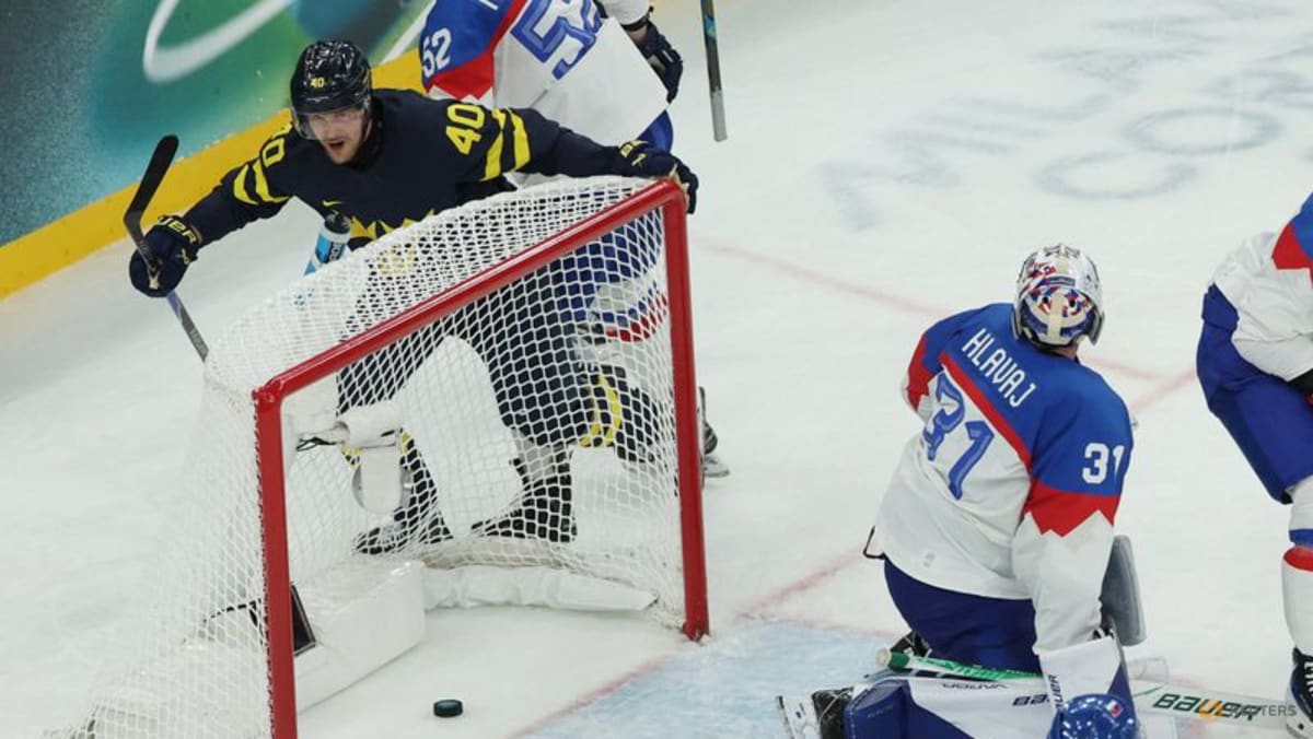 Ice hockey-Sweden hold off Slovakia, Latvia beat Germany
