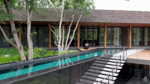 A swimming pool takes centre stage at this tropical modernist architecture in Thailand