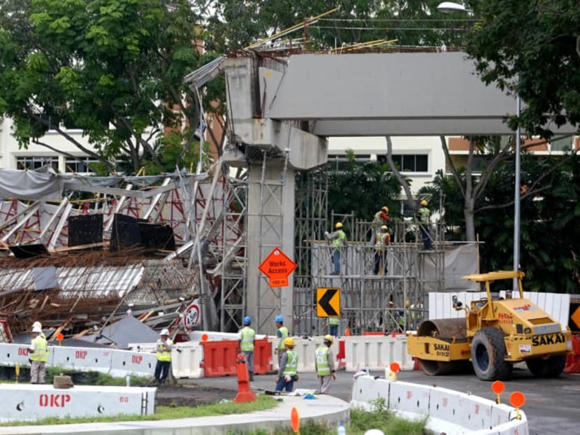 Workers stand on scaffolding beside the collapsed structure at an LTA worksite along PIE on July 14, 2017. Photo: Nuria Ling/TODAY