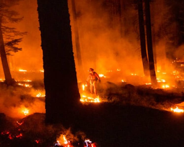 California wildfire flares but within line crews have built