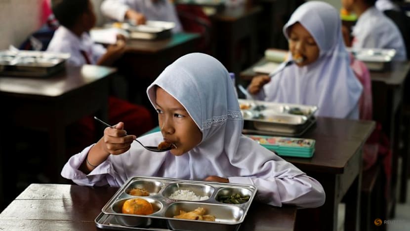 Some remote Indonesian communities still await free meals as programme resumes after review