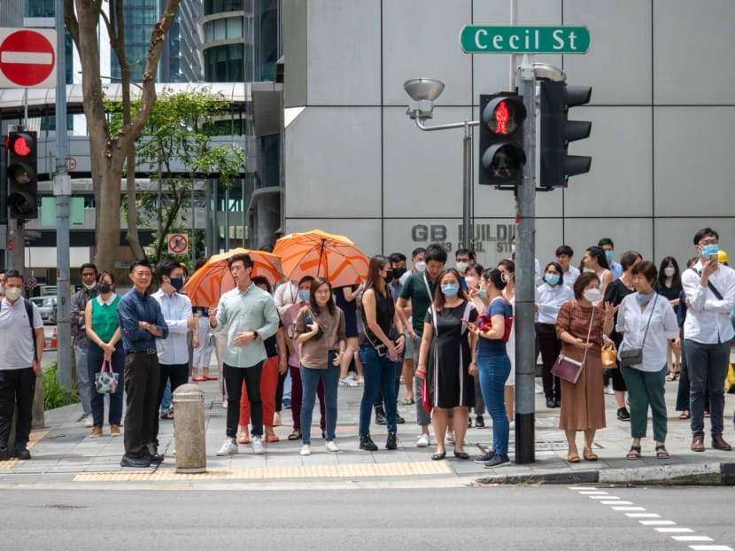 People are seen in the Central Business District on April 26, 2022.
