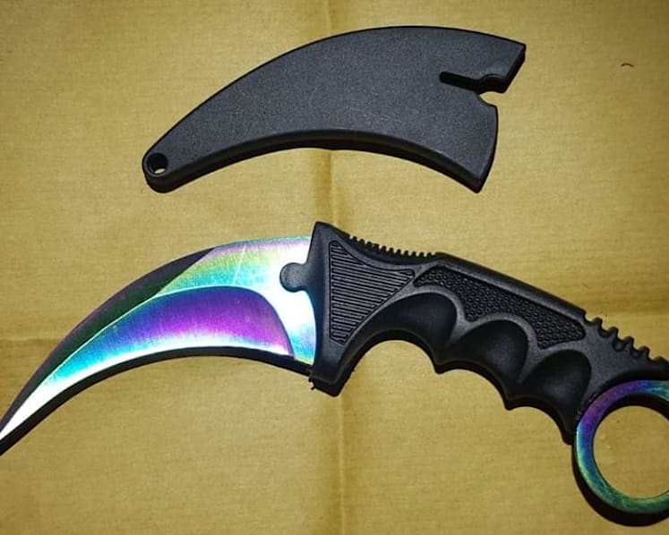 7 arrested for allegedly rioting while armed with karambit knife