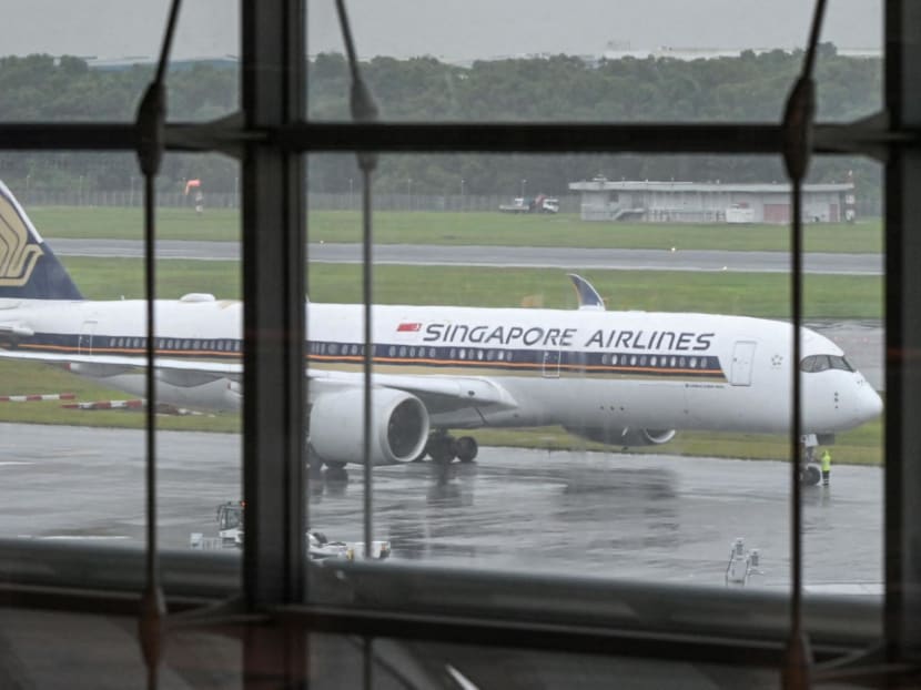 A Singapore Airlines plane waits to depart at Singapore Changi Airport in Singapore on December 2, 2021. A Singapore Airlines plane waits to depart at Singapore Changi Airport in Singapore on December 2, 2021.