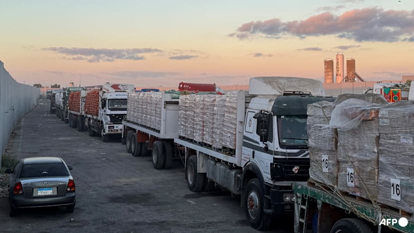 Aid trucks roll into Gaza as dispute over hostage bodies pauses 