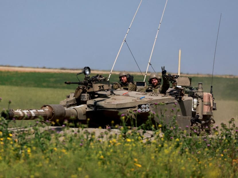 Israeli soldiers in a tank maneuver near Israel's border with Gaza, amid the ongoing conflict between Israel and the Palestinian Islamist group Hamas, in southern Israel, on March 21, 2024. 