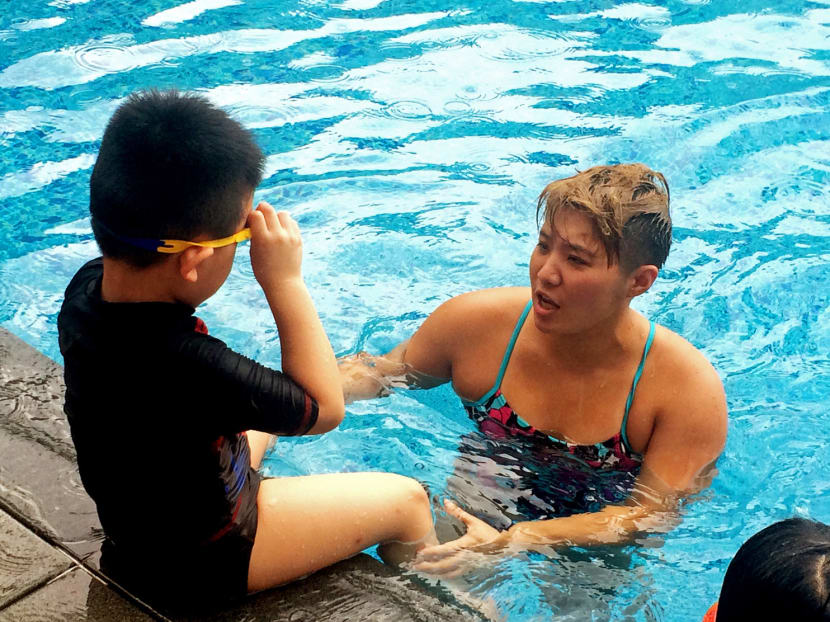 Tao Li, in coaching mode at her academy at the Temasek Club, is keen to give back to Singapore and help push swimming up to another level. Photo: Adelene Wong