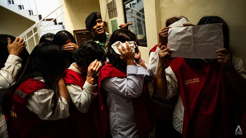 Indonesia baby trafficking trial begins for 19 people accused of sending at least 10 newborns to Singapore