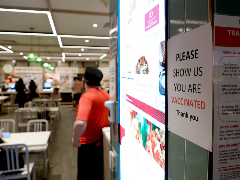 A notice outside a restaurant in Ion Orchard mall asking diners to show their vaccination status.