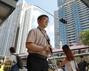 What one man is teaching Singaporeans about living with the visually impaired – a crossing, a tour, a firm ‘no’ at a time