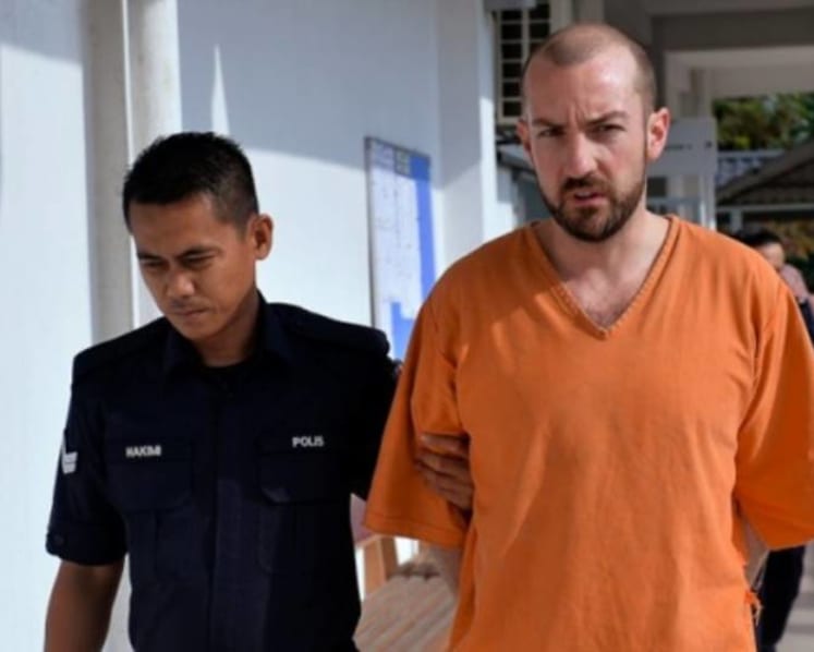 Man fined for trying to open door of Malaysia Airlines plane midair