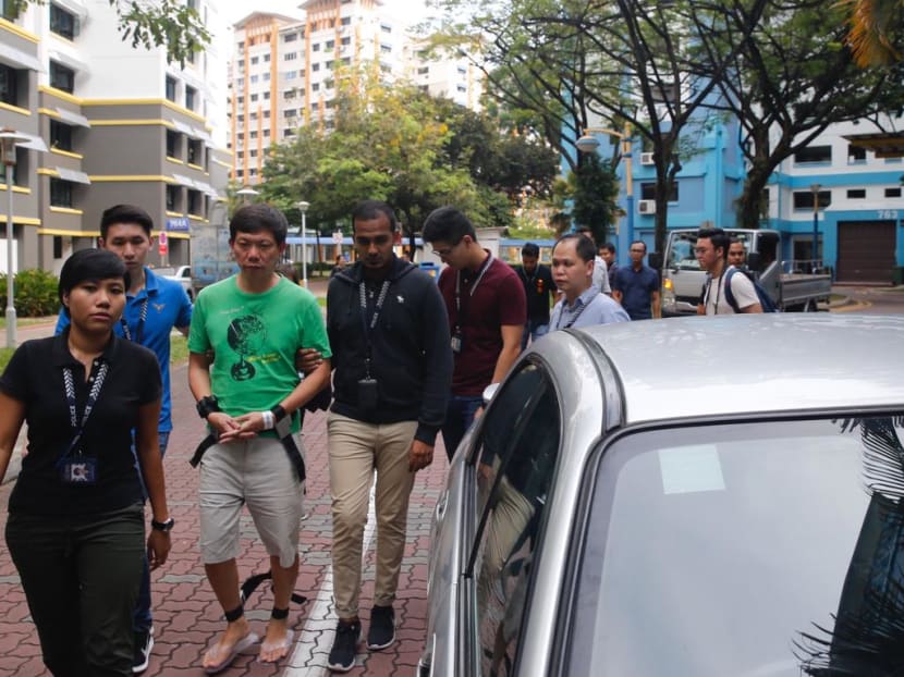 Samuel Tan Joo Soon (in green), taken back to the scene in July 2017.