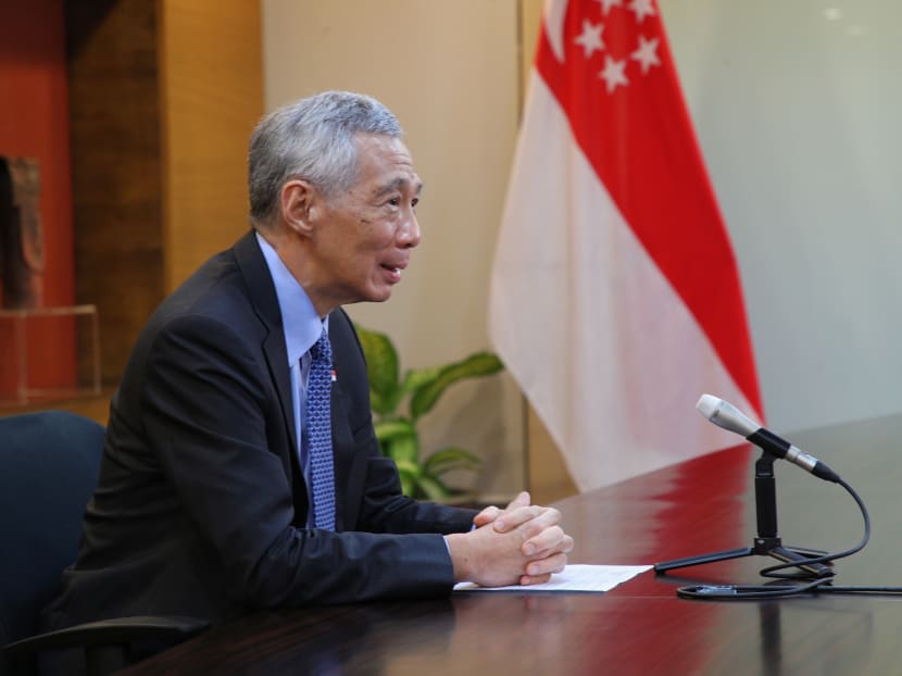 Prime Minister Lee Hsien Loong speaking to reporters in Singapore in a virtual press conference at the end of his visit to Jakarta for an Asean sumiit.