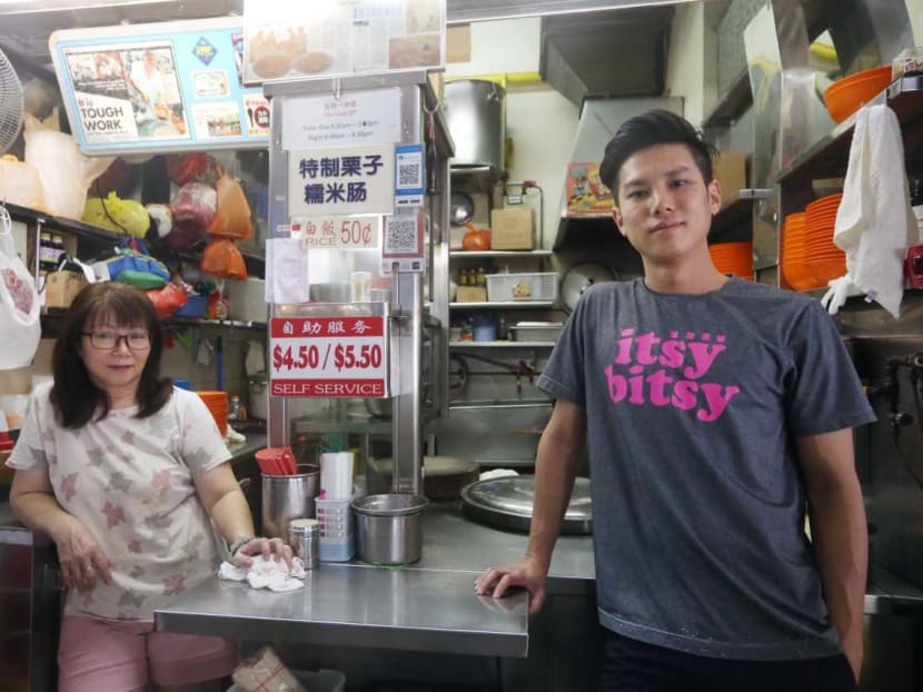Mr Thomas Koh of Koh Brothers Pig Organ Soup, photographed with his mother Madam Jenny Lim. The young hawker left his job as a graphic designer six years ago to help out at his parents’ stall in Tiong Bahru market.
