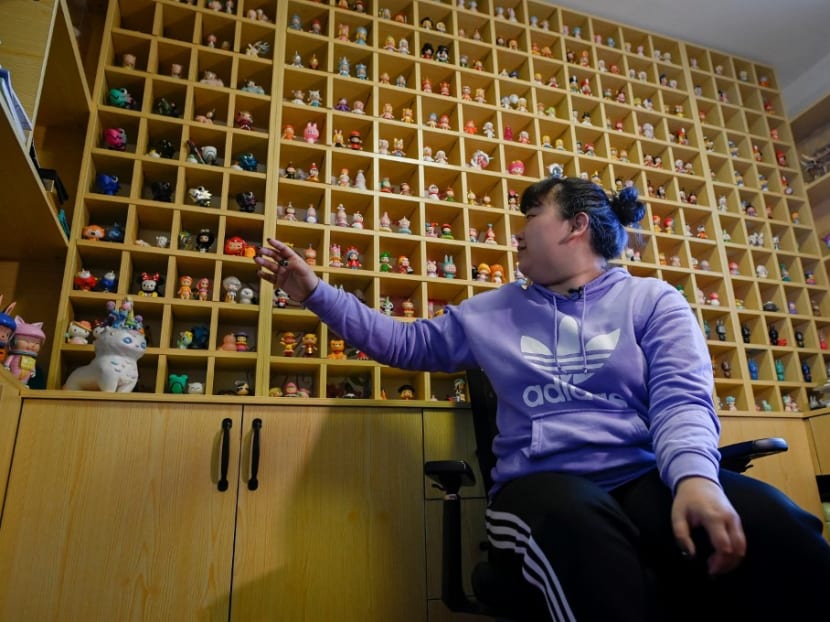 This picture taken on April 13, 2021 shows music student Wang Zhaoxue showing the "blind box" toys she collected, during an interview at her home in Beijing. This picture taken on April 13, 2021 shows music student Wang Zhaoxue showing the "blind box" toys she collected, during an interview at her home in Beijing.