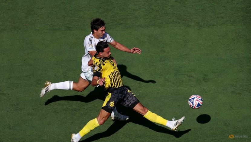 Real Madrid survive Dortmund scare to reach Club World Cup semis Real Madrid survive Dortmund scare to reach Club World Cup semis