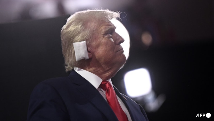 Trump, ear bandaged, appears at Republican National Convention Trump, ear bandaged, appears at Republican National Convention