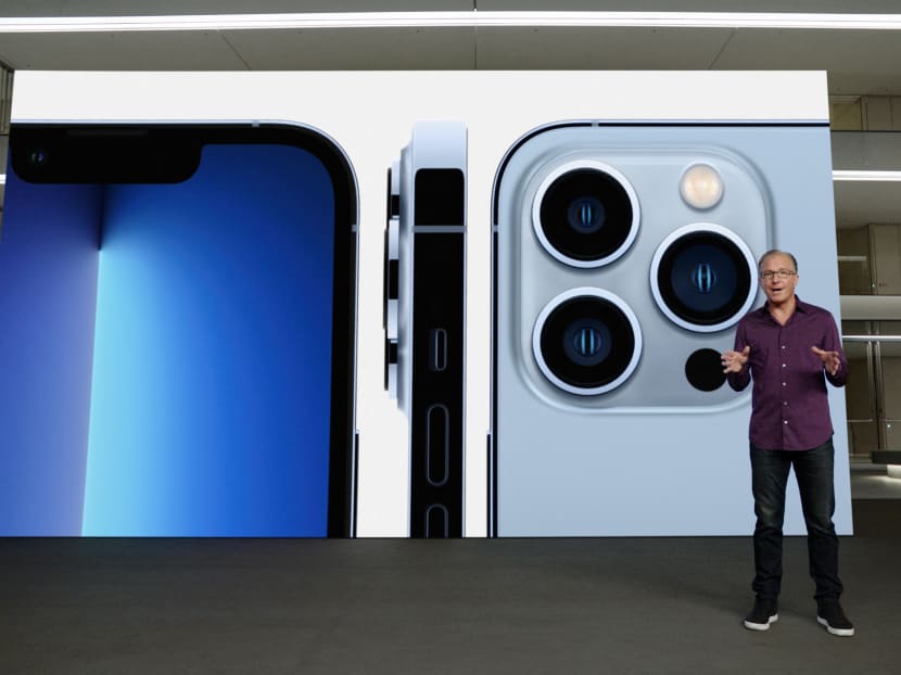 Apple's senior vice president of Worldwide Marketing Greg Joswiak talking about the new iPhone 13 Pro during a special Apple event, as seen in this still image from the keynote video. Apple CEO Tim Cook strode through a slickly produced video Tuesday to launch a new iPhone, with few hints of the exceptional string of troubles facing his company including policy reversals, a spyware attack and legal fights.