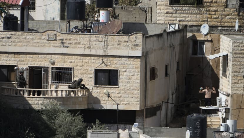 Israel investigates after videos show soldiers pushing bodies off West Bank roof