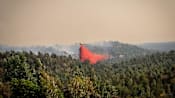 Fire in southwestern Spain active as 470 moved to safety