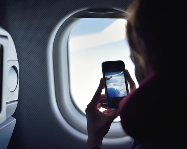 CNA Explains: Should you switch off your phone while on a flight?